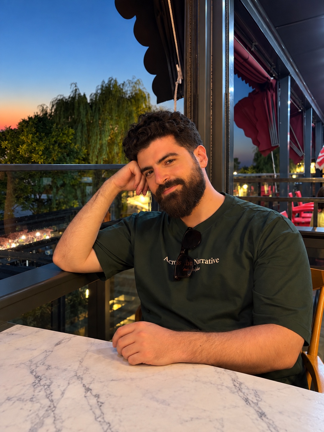 Rami, founder of Hermit, at a café table